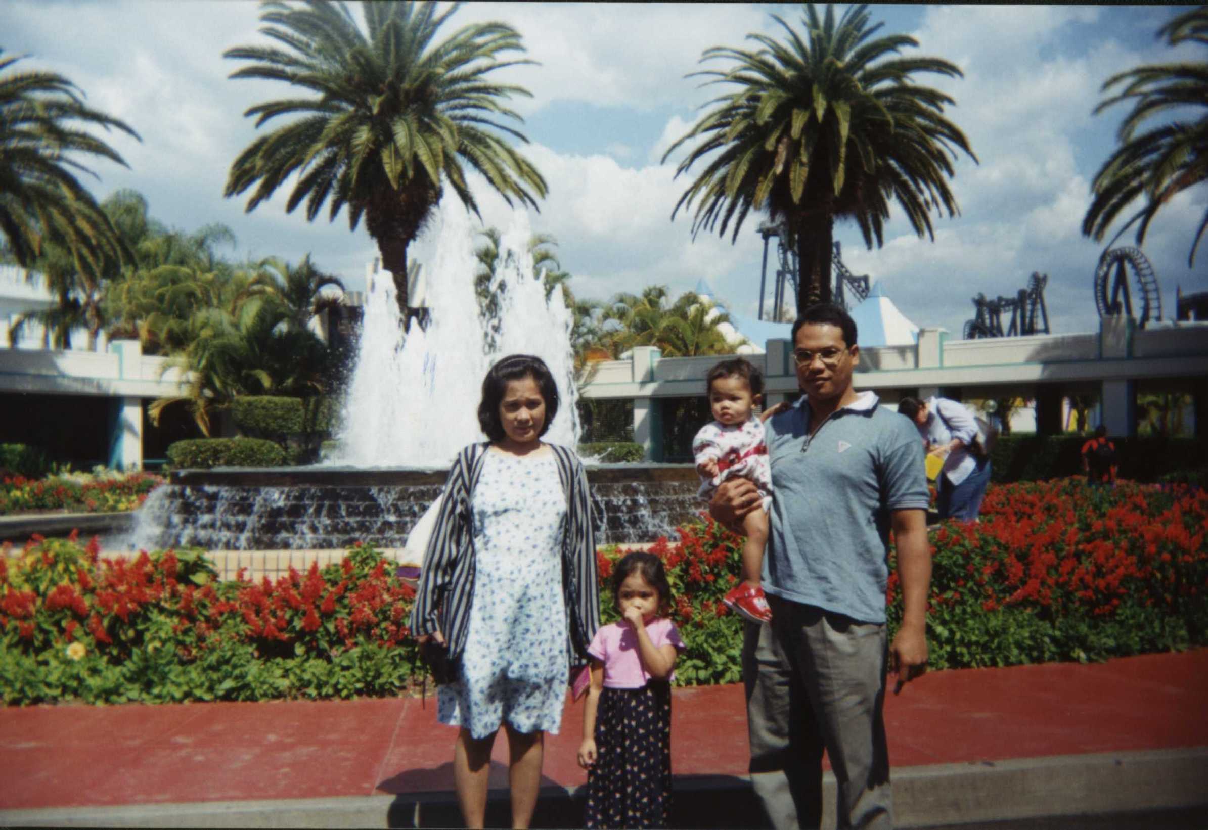 A woman playing with children; Actual size=180 pixels wide